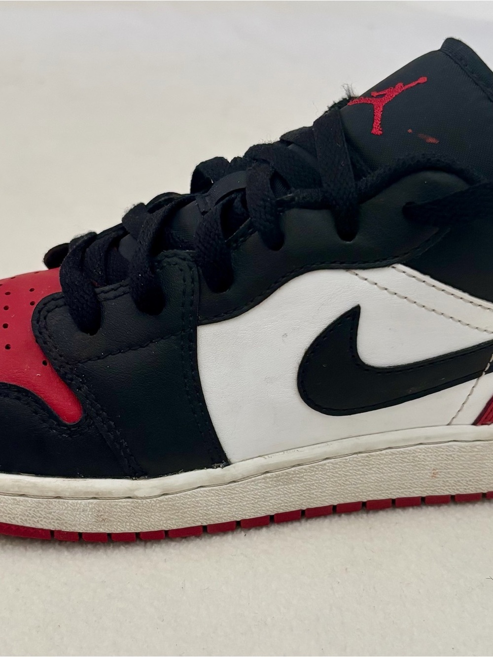 Jordan 1 Kids Black/White/Red Low Top Lifestyle Sneakers